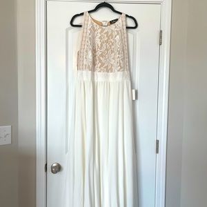 White Lulu Weddings Dress with lace top. Never been worn with tags still on it.